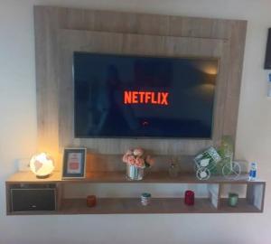 a tv sitting on top of a shelf in a room at Studio Monoambiente Urbano en radar centrico,completo y funcional con Alexa in Ushuaia
