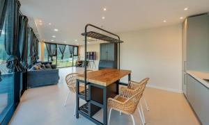 a kitchen with a table and chairs in a room at Aldea de Pangsion Pool Villa in Pohang +8 photos