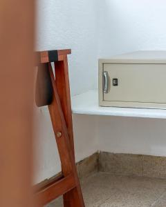 a wooden ladder leaning against a shelf in a room at Hotel Mariscal in Mexico City +29 photos