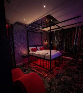 a bedroom with a swing bed and purple walls at Love Room- Adult Only in Bucharest +34 photos