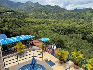 a view of the mountains from the balcony of a resort at Finca Altamira in La Vega