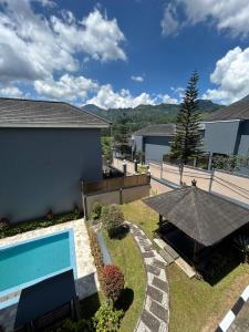 an image of a backyard with a swimming pool at Al Andalus Resort Puncak in Puncak