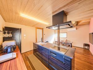 a kitchen with a sink and a counter top at 縁や出雲 in Taisha