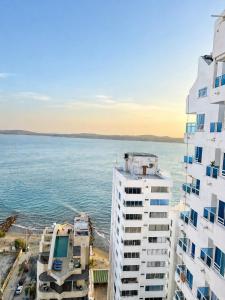 a view of the ocean from a building at Loft playa y mar in Cartagena de Indias