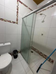 a glass shower in a bathroom with a toilet at Quarto privado próximo ao centro 3 in Manaus