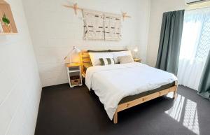 a bedroom with a large bed and a window at Another 'Your Place on Davidson!' in Mount Isa