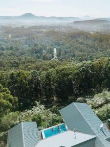 an aerial view of a house with a swimming pool at Wilderness House in Kulangoor