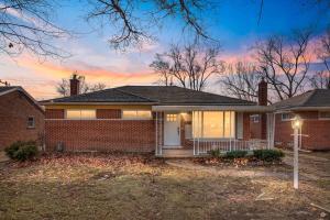 a brick house with a sunset in the background at Gn4 - Sleek Private Room Ideal for Remote Work, Wi-Fi, Free Parking in Beech