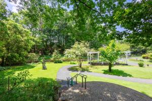 a garden with a playground and a swing at フォレストヒルズガーデン in Mihara