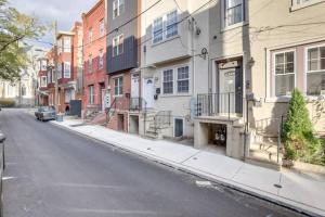 a city street with buildings and a car parked on the street at Private Room | Temple | Fast WiFi | Kitchen V in Philadelphia