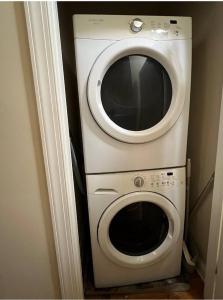 a dryer and a washing machine in a room at Private Room | Temple | Fast WiFi | Kitchen V in Philadelphia