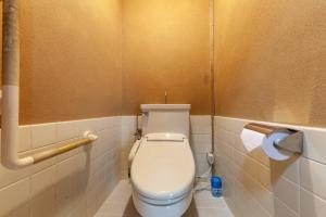 a bathroom with a toilet and a roll of toilet paper at Daini Kuwamura Building 4th in Tokyo +10 photos