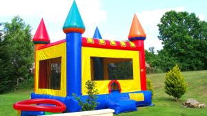 a childs play house in a yard at River Cottage - La Mare Chappey in Néhou +10 photos