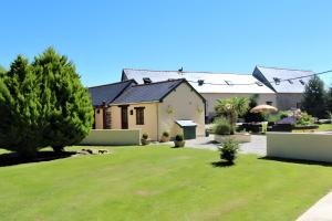 a house with a yard in front of it at River Cottage - La Mare Chappey in Néhou