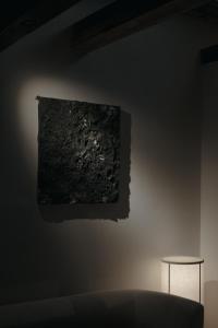 a painting on a wall in a room with two stools at Haku-ma 白間 in Kanazawa +59 photos