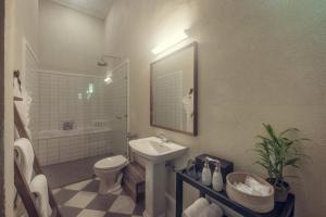 a white bathroom with a sink and a toilet at Nine Skies By Teardrop Hotels in Ella +40 photos