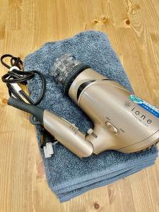 a flashlight sitting on top of a blue towel at GoodStay505 in Kurume