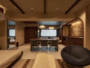 a large living room with a table and chairs at illi Atra Aoyama in Tokyo