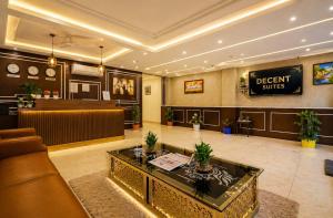 a lobby with a waiting room and a dental clinic at Hotel Decent Premier Suites Near Delhi Aerocity in New Delhi