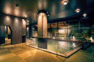 a large pool of water in a building at Ooedo Onsen Monogatari Premium Shirahama Gyoen in Shirahama +58 photos