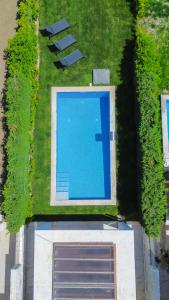 an overhead view of a swimming pool in the grass at Villa Mare 2 - Private Pool, Sea View, Starlink, 4 Bdrms in Hanioti