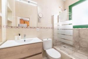 a bathroom with a toilet and a sink and a shower at Nafeti in Palma de Mallorca +16 photos