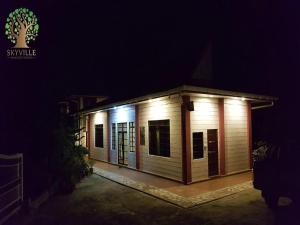 a small house with lights on it at night at Skyville Zen Resort,Kundasang in Kampong Kundassan