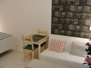 Giường trong phòng chung tại Studio apartment - Green door
