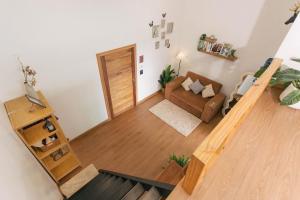 an overhead view of a living room with a stairway at Sinsup villa Mountain View 2 in Ban Huai Khai