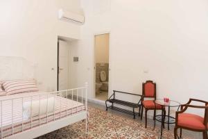 Postel nebo postele na pokoji v ubytování B&B Domus Aurea
