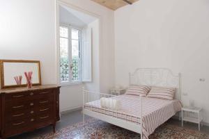Postel nebo postele na pokoji v ubytování B&B Domus Aurea
