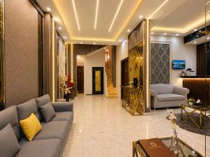 a living room with a couch and a table at Rehana Pyramids View in Cairo