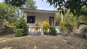 a small house with a fence in front of it at Hotel Saffron Indian Spice Resort in Chitrāwal
