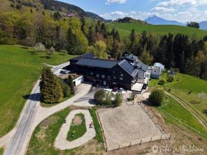 an aerial view of a large house in a field at Pension Irlingerhof in Mondsee