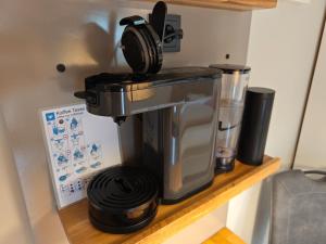 a coffee maker on a shelf in a kitchen at Apartment Maiglöckchen in Fritzlar