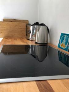 a kitchen counter with two appliances on a shelf at House Between Forest And Fields In Brandenburg in Casekow