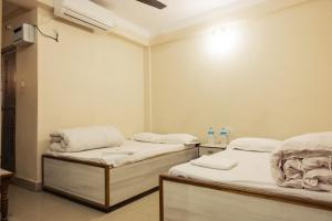 a hospital room with two beds in it at Aanand Hotel in Janakpur +3 photos