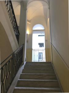 
a staircase leading up to a stairway with stairs at Palazzo Gallo in Palermo
