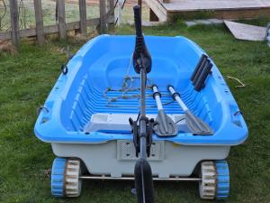 a blue kayak on the grass in a yard at Lake Loft in Alingsås