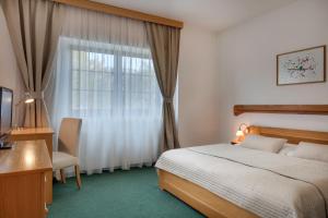 Postel nebo postele na pokoji v ubytování Hotel Oya