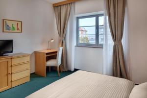 TV a/nebo společenská místnost v ubytování Hotel Oya