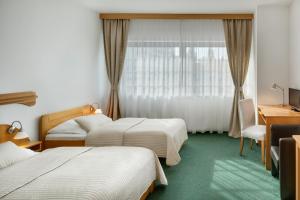 Postel nebo postele na pokoji v ubytování Hotel Oya