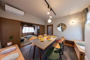 a dining room with a table and chairs at Ninifuni Kanazawa in Kanazawa