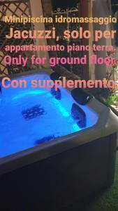 a bath tub with blue water in a yard at Villa Grace Amalfi seaview Jacuzzi in Amalfi