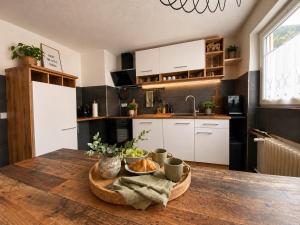 a kitchen with a table with a bowl of food on it at Bollenhut 1 in Bad Wildbad