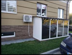 a house with a air conditioner on the side of it at Nest & Rest Studio in Chişinău