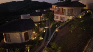 an aerial view of a group of houses with lights at Atalaya Resort El Nido in El Nido
