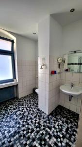 a bathroom with a sink and a toilet at Apartments Kolo 77 in Berlin +43 photos