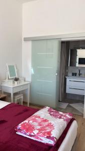 a bedroom with a bed and a desk and a kitchen at Panorama House Opatija in Donji Rukavac +47 photos