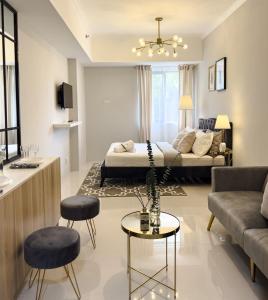 a living room with a couch and a table at Casa De Baguio in Town Center in Baguio